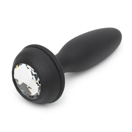 Black silicone anal plug with jewel base, ideal for beginners and experienced users alike, provides comfortable and elegant stimulation.