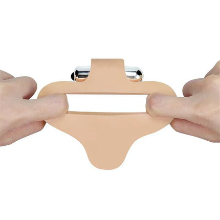 Person stretching Anal Stimulator The Ultra Soft Bead 6.5 with Vibration Flesh showcasing flexibility and softness.