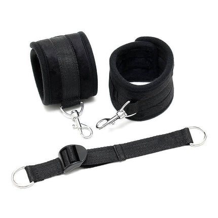 Black Ankle Cuffs with Adjustable Spreader Strap and Velcro closure, featuring durable karabine hooks and nylon material for secure restraint.