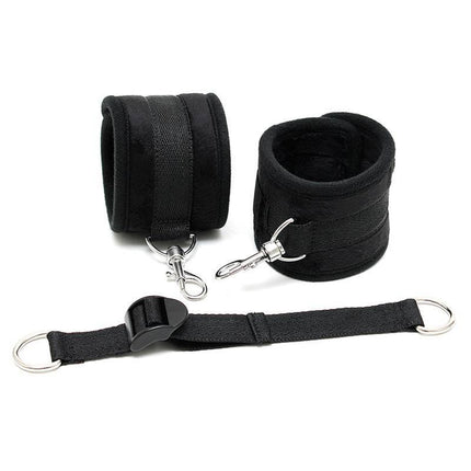 Ankle Cuffs with Adjustable Spreader Strap in black with Velcro closure and karabine hooks, designed for adult restraint.