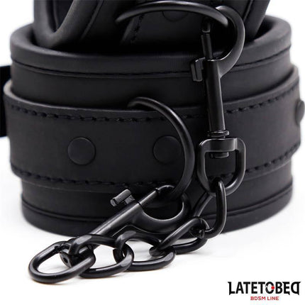 Close-up of black Ankle Restraints Neoprene Adjustable with metal chain and buckle for secure sensory play.