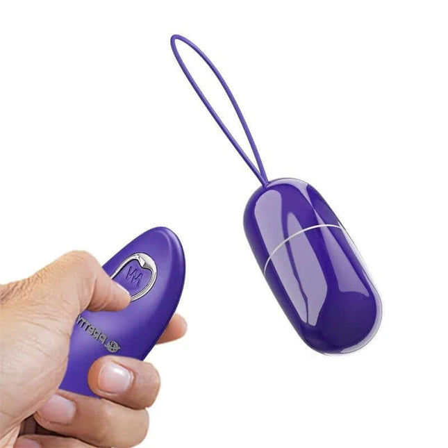 Close-up of Arvin Youth Egg Vibrator with Remote in purple, showcasing ergonomic design and control.