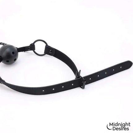 Ball Gag with Nipple Clamps in black vegan leather, featuring breathable design and adjustable straps, by Midnight Desires.
