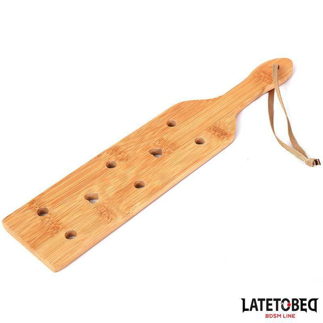 Bamboo paddle 34 cm BDSM accessory by Latetobed with holes and handle for effective impact play.