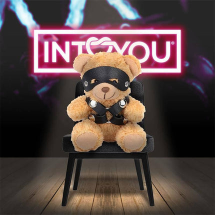 Bearly Keychain BDSM Teddy Bear with Chest Harness on chair with neon background