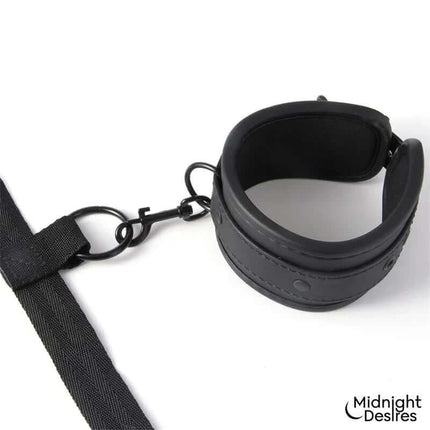 Bed Restraint Set featuring adjustable vegan leather cuff and strap for secure, comfortable fit by Midnight Desires.