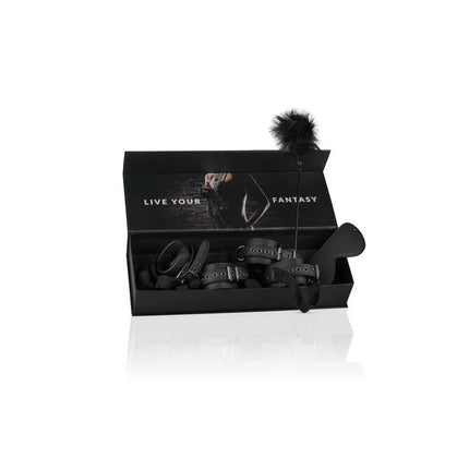 Beginners Bondage - Fntasy Kit featuring handcuffs, ankle cuffs, eye mask, tickler, and stimulating pens in black box.