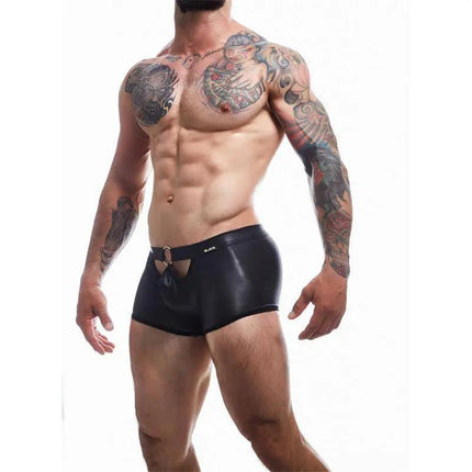 Model wearing BL4CK03 Peekaboo Mini Pants, showcasing sleek leather-inspired design with underwire for men by CUT4MEN.