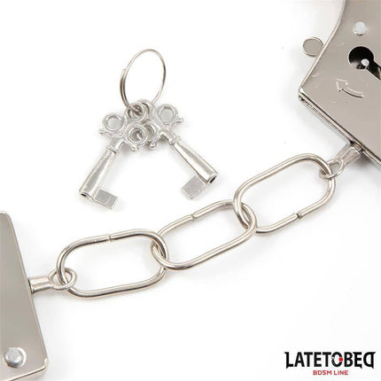 Black Furry Metal Handcuffs for BDSM Play with keys, featuring metal links and a sturdy design from Latetobed BDSM Line.