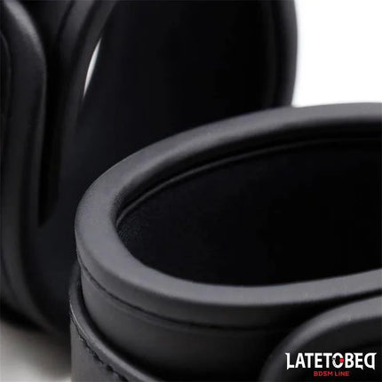 Close-up of Black Leather Handcuffs - Sturdy Wrist Restraints from Latetobed BDSM Line, showcasing durable PU leather cuffs.