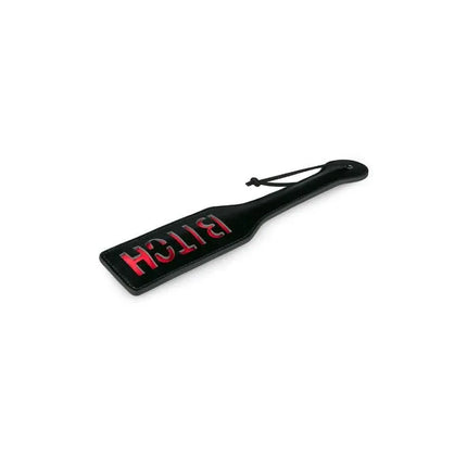 Black Leather Paddle - Bitch with red inscription, high-quality BDSM accessory for consensual play.