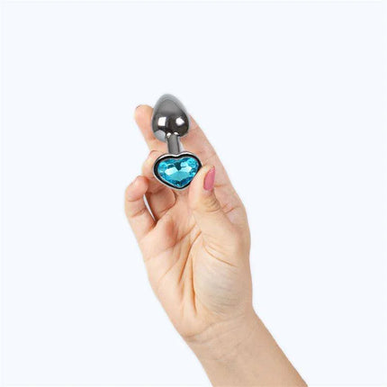 Blue Heart Metal Butt Plug Size S held in hand, showcasing the premium aluminum design with a blue heart base.