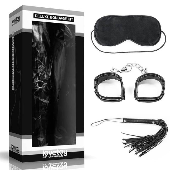 Bondage Kit Deluxe Black with blindfold, handcuffs, and flogger in box packaging