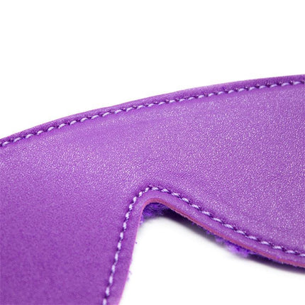 Close-up of a purple accessory from the Bondage Set 10 Pieces Purple featuring soft fabric and detailed stitching.