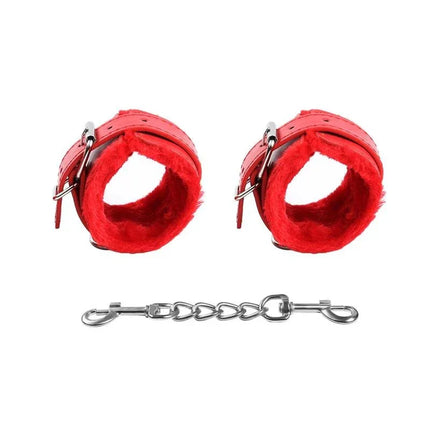 Red handcuffs from Bondage Set 10 Pieces Red with velvet lining and chain, perfect for couples exploring BDSM restraint and control.