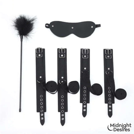 Bondage Set with Blindfold, Feather Tickle and Cuffs featuring soft vegan leather cuffs and elegant silver hardware.