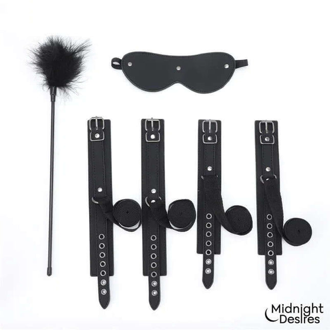 Bondage Set with Blindfold, Feather Tickle and Cuffs featuring soft vegan leather cuffs and elegant silver hardware.