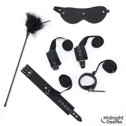 Bondage Set with Blindfold, Feather Tickle and Cuffs by Midnight Desires, featuring vegan leather and silver hardware for couples.