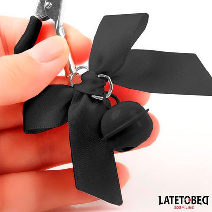 Close-up of Bow Nipple Clamps with Bell featuring a sleek design from Latetobed's BDSM line.