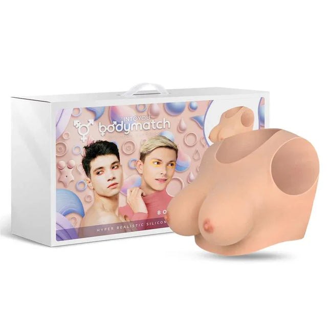 Bowie Realistic Breast Form D Cup Liquid Silicone by Bodymatch in front of product packaging, offering hyper-realistic detail.