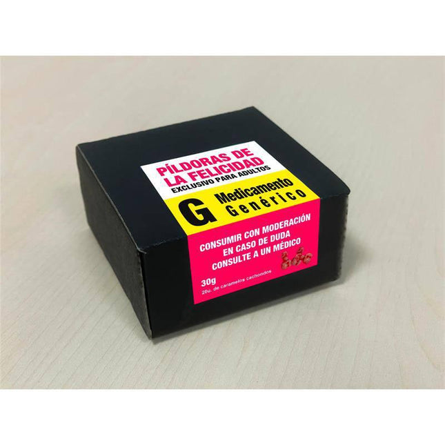 Black box of 'Píldoras de la Felicidad' with instructions in Spanish on wooden surface