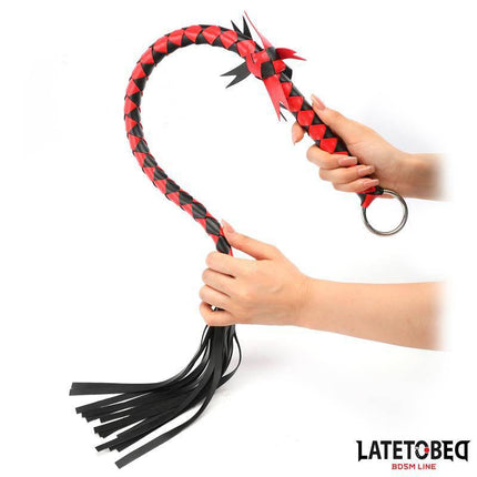 Braided Flogger 85 cm with red and black design held in hands from Latetobed BDSM Line