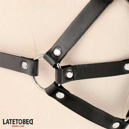 Close-up of Breast Harness Adjustable in black PU and metal from Latetobed BDSM line.