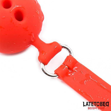 Close-up of Breathable Silicone Ball Gag S - 4 cm in vibrant red with adjustable strap and secure metal ring