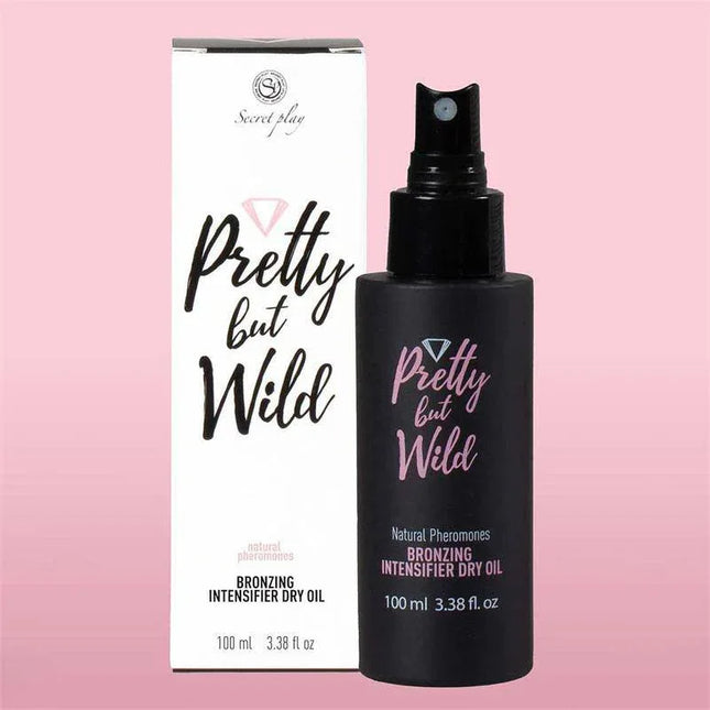 Pretty But Wild Bronzing Intensifier Dry Oil bottle and packaging on pink background