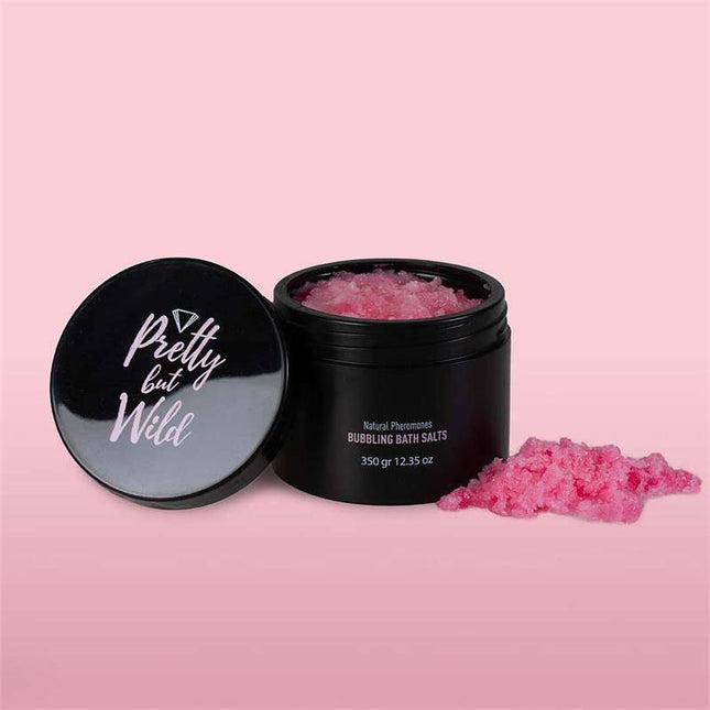 Pretty but Wild Bubbling Bath Salts in a 350g jar on a pink background, showcasing plant-based exfoliant and relaxing skin treatment.