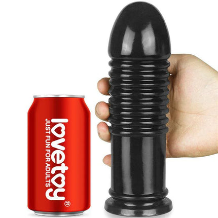 Butt Plug King Sized Anal Bumper 8 Black next to a soda can for size comparison