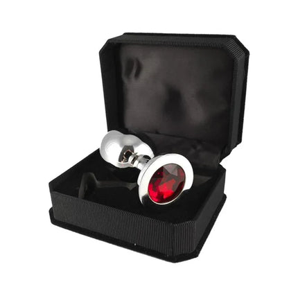 Butt plug, metal-9,7 cm long with red glass top in black case, stainless steel