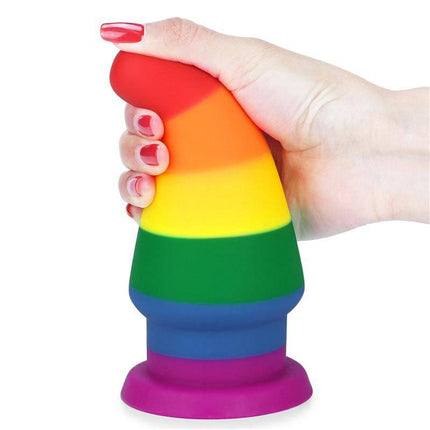 Hand holding Butt Plug Prider 6 LGBT in rainbow colors, made of medical-grade silicone, promoting Pride celebration.