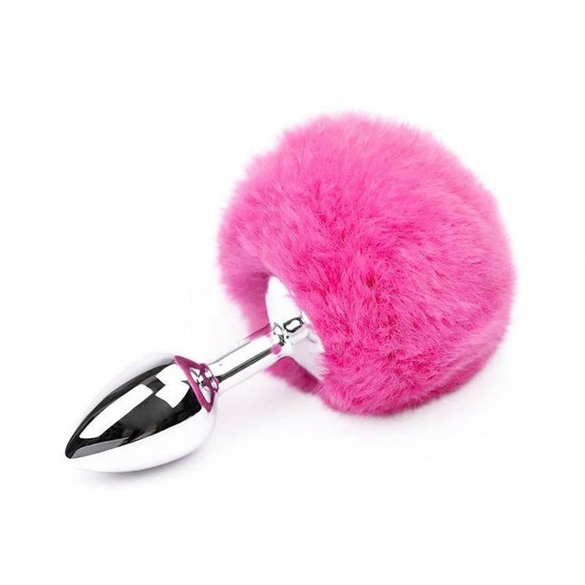 Butt Plug with Pompon Pink Size S featuring a shiny metal plug with a soft pink pompon for safe and stylish anal play.