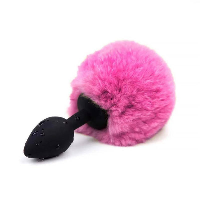 Butt Plug with Pompon Pink Size S, featuring a playful pink pompon accent for a stylish and comfortable anal experience.