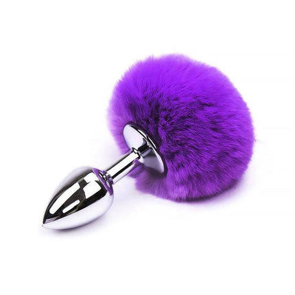 Butt Plug with Pompon Purple Size S featuring a smooth metal design with a fluffy purple pompon for stylish and comfortable use.