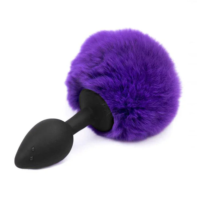 Butt Plug with Pompon Purple Size S featuring a fluffy purple pompon for stylish anal exploration.
