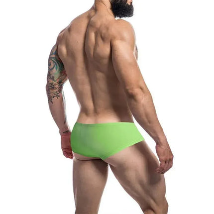Model wearing C4M Booty Shorts Neon Green showcasing the bold design and fit from CUT4MEN.