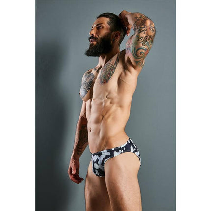 Model wearing C4M01 Low Rise Bikini Brief Camo by CUT4MEN, showcasing modern design and comfort in camouflage pattern.