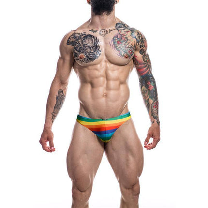 Model wearing C4M01 Low Rise Bikini Brief Rainbow by CUT4MEN showcasing bold design and comfort.