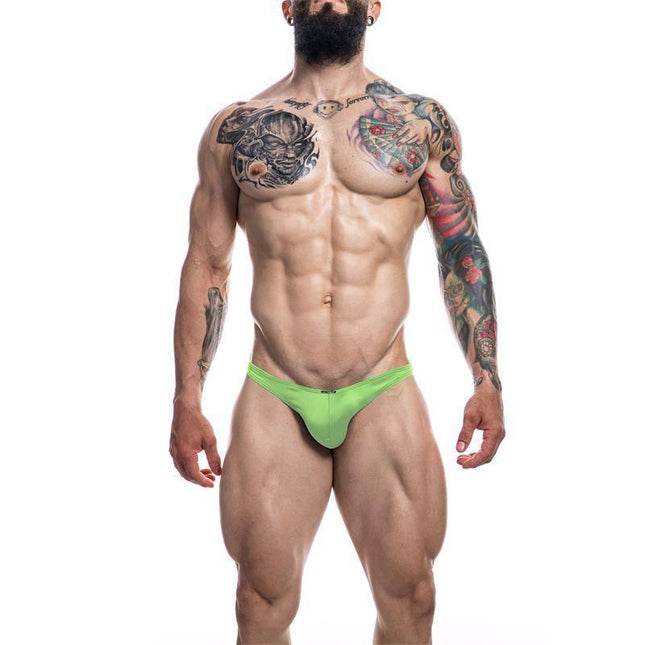 C4M03 Classic Thong Neon Green by CUT4MEN showcased on a model, highlighting the bold neon color and minimalist silhouette.
