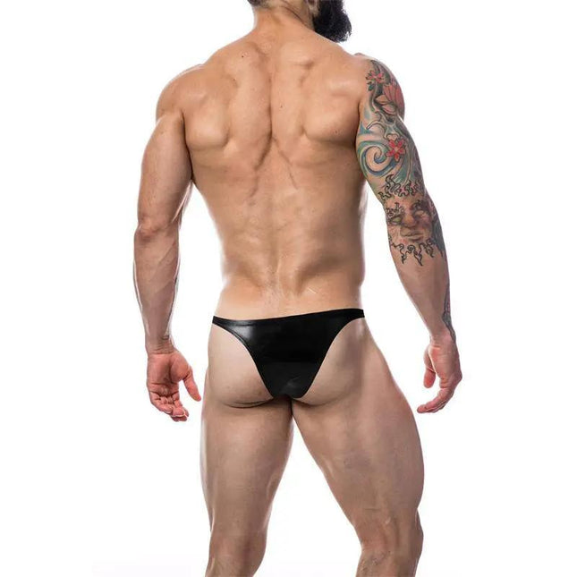 Back view of model wearing C4M11 Brazilian Brief Leatherette Black by CUT4MEN, showcasing bold design and flexible fabric.