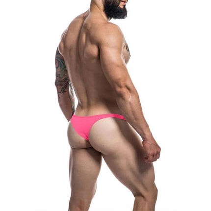 C4M11 Brazilian Brief Neon Coral by CUT4MEN, stylish modern men's underwear, rear view of model showcasing vibrant coral color and fit
