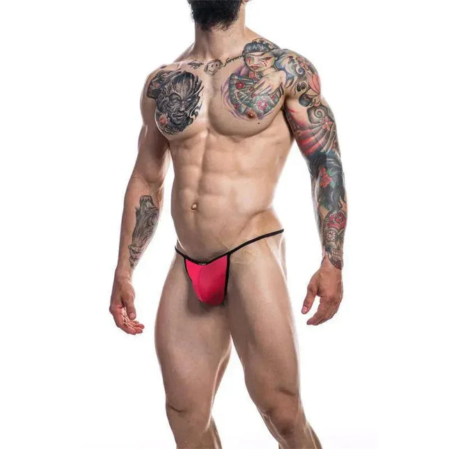 Model wearing C4M12 Briefkini RedOTS, modern men's underwear by CUT4MEN, featuring a bold red design for comfort and style.