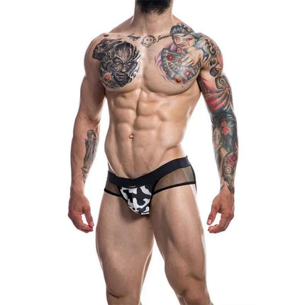 Model wearing C4M13 Mixed Jockstrap Shadow Camo by CUT4MEN, showcasing bold shadow camo pattern and transparent accents