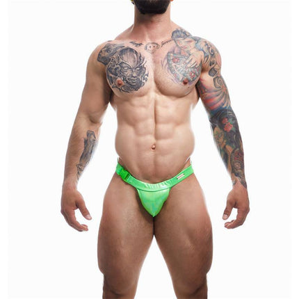Man wearing C4M32 Brief / Swimwear Emerald Green showcasing sleek, versatile design for comfort and style.