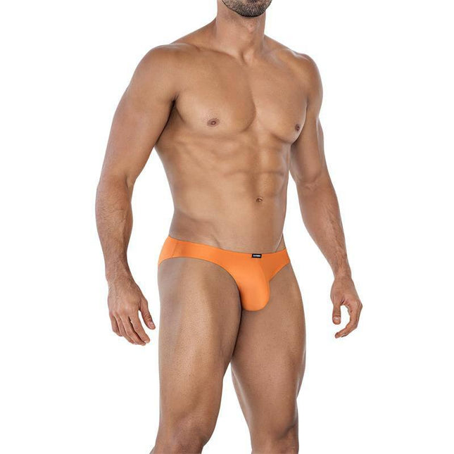 Model wearing C4MSPX01 Micro Brief Copper Spring, showcasing versatile underwear and swimwear in bold copper color.