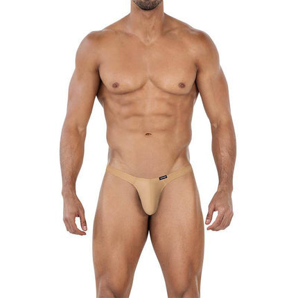 Model wearing C4MSPX06 Brazilian Thong Golden Sand, showcasing vibrant color and comfortable fit.