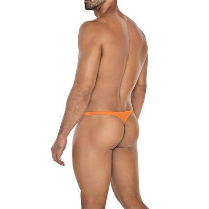 Model wearing C4MSPX11 Micro Thong Copper Spring by CUT4MEN showcasing comfortable fit and vibrant color.