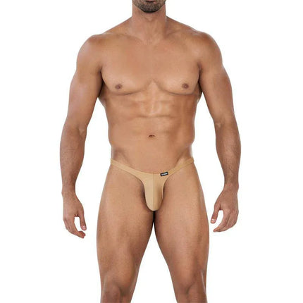 C4MSPX11 Micro Thong Golden Sand on male model showcasing bold, comfortable fit in soft polyamide and elastane blend.